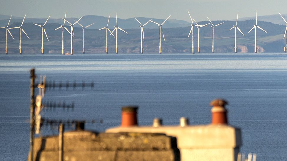 The Robin Rigg wind farm in the Solway Firth is seen over homes in Whitehaven where West Cumbria Mining (WCM) have been given approval to once again extract coal on December 08, 2022
