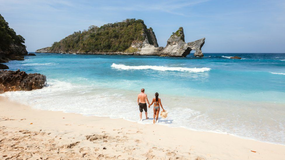 A couple on a beach in Bali